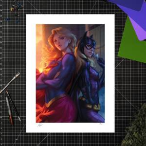 Lámina artística de Supergirl y Batgirl de Stanley “Artgerm” Lau
